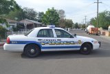 A Lemoore police vehicle blocks the entrance to Powell Street after a suspect fled police.